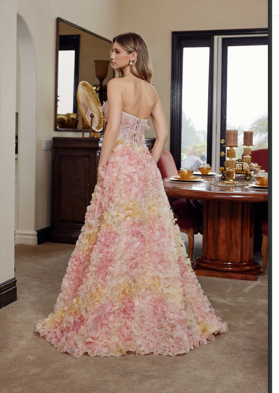 Long tulle ball gown with full flower applique tie back